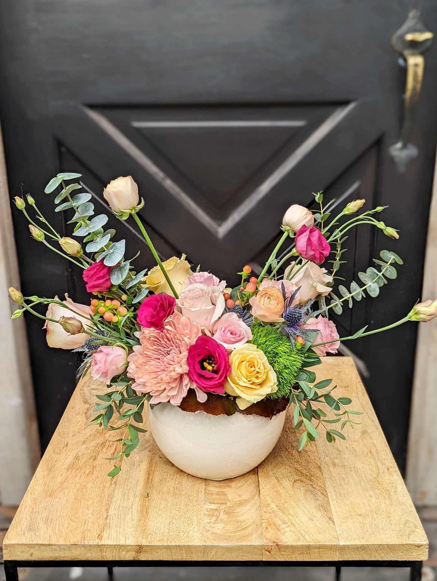 The Watering Can | A european arrangement of expanded blush tones featuring roses.