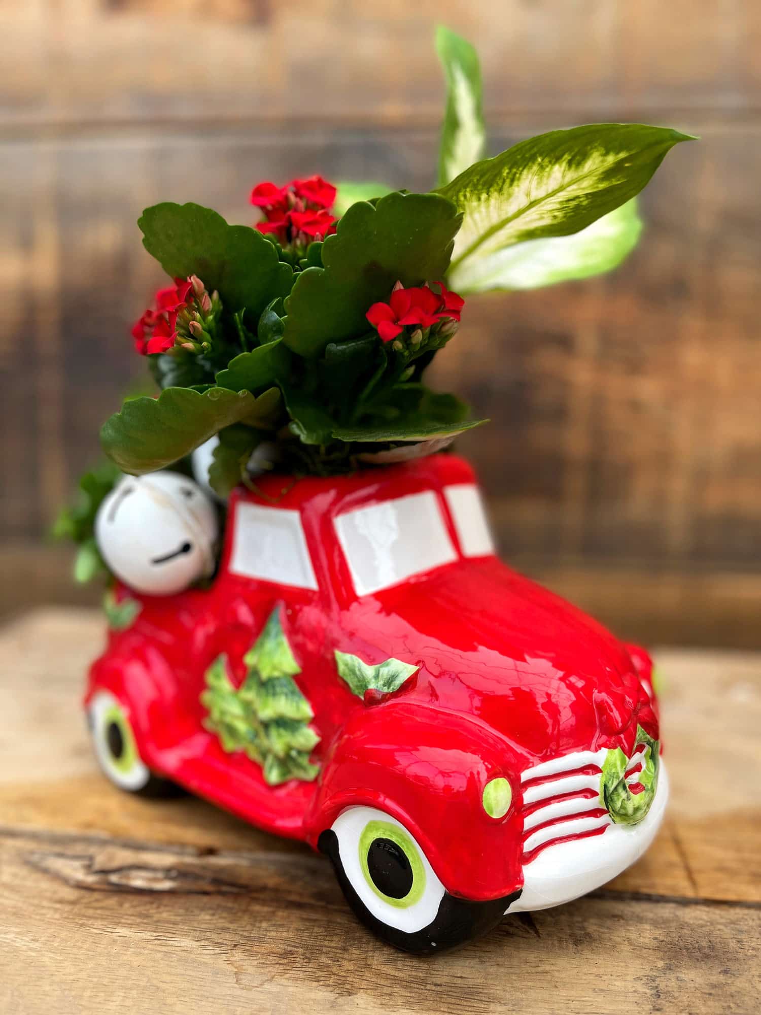 The Watering Can | A planter designed in the bed of a red ceramic pick up truck.