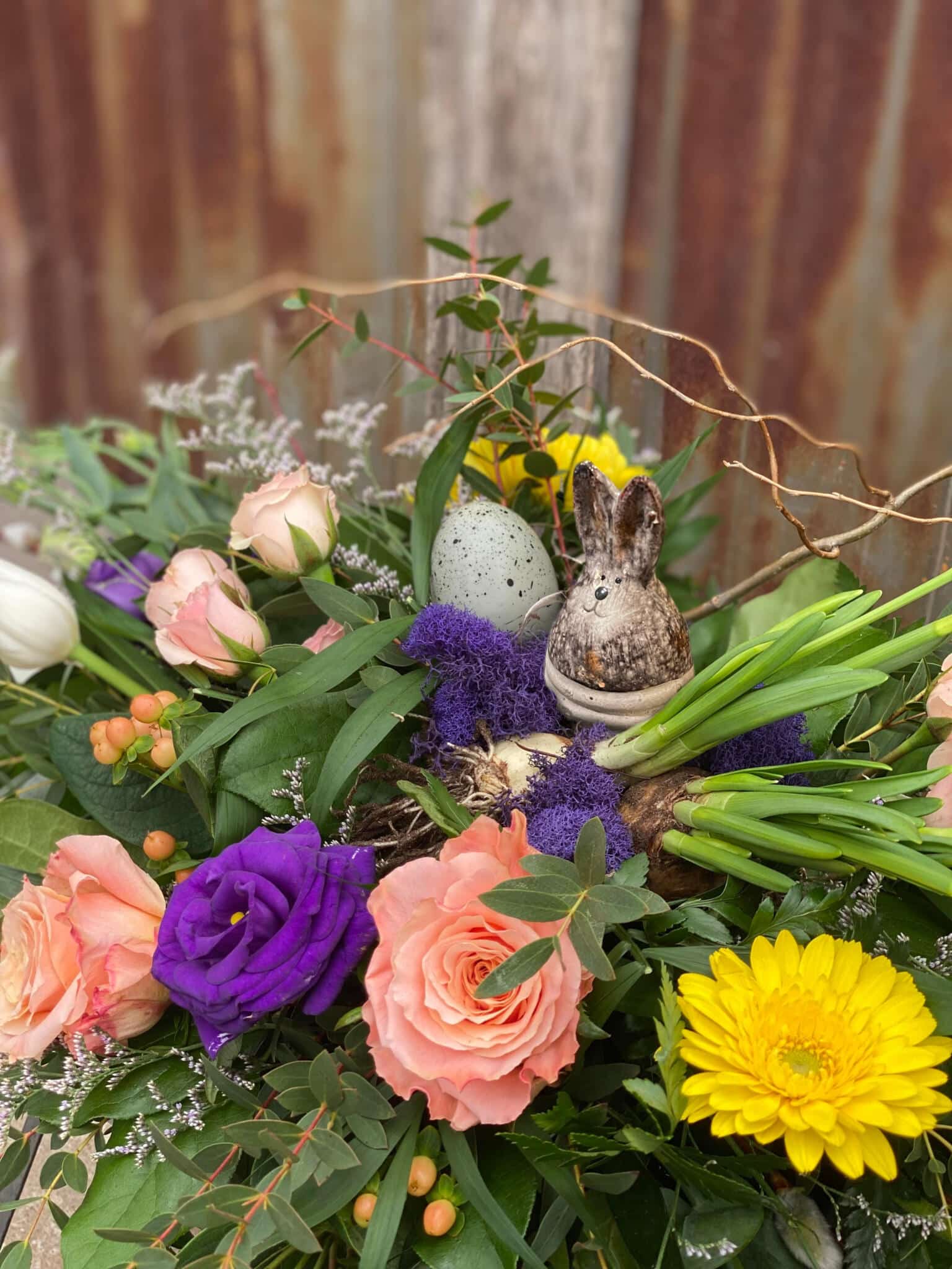 A fresh Easter table floral arrangement with spring blooms from The Watering Can Flower Market floral boutique